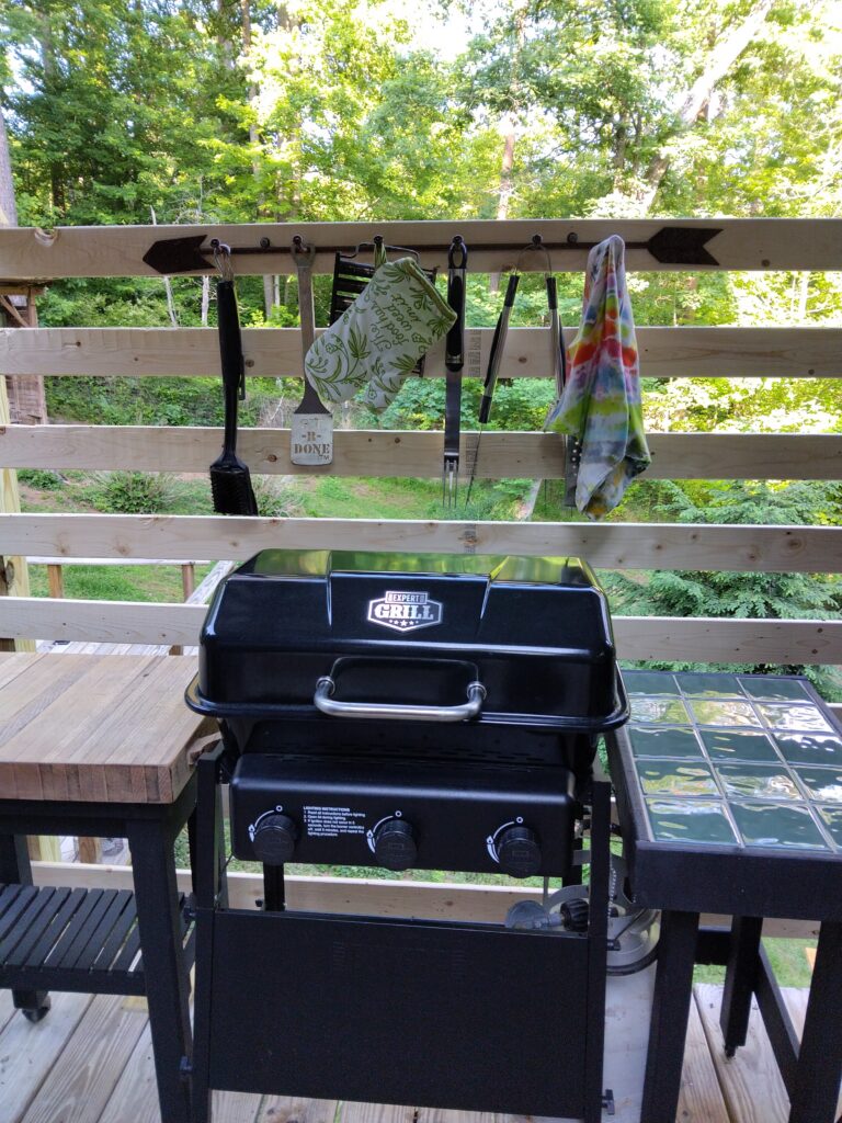 Cheap grill...big effect. Take off the side tables for a custom fit.
