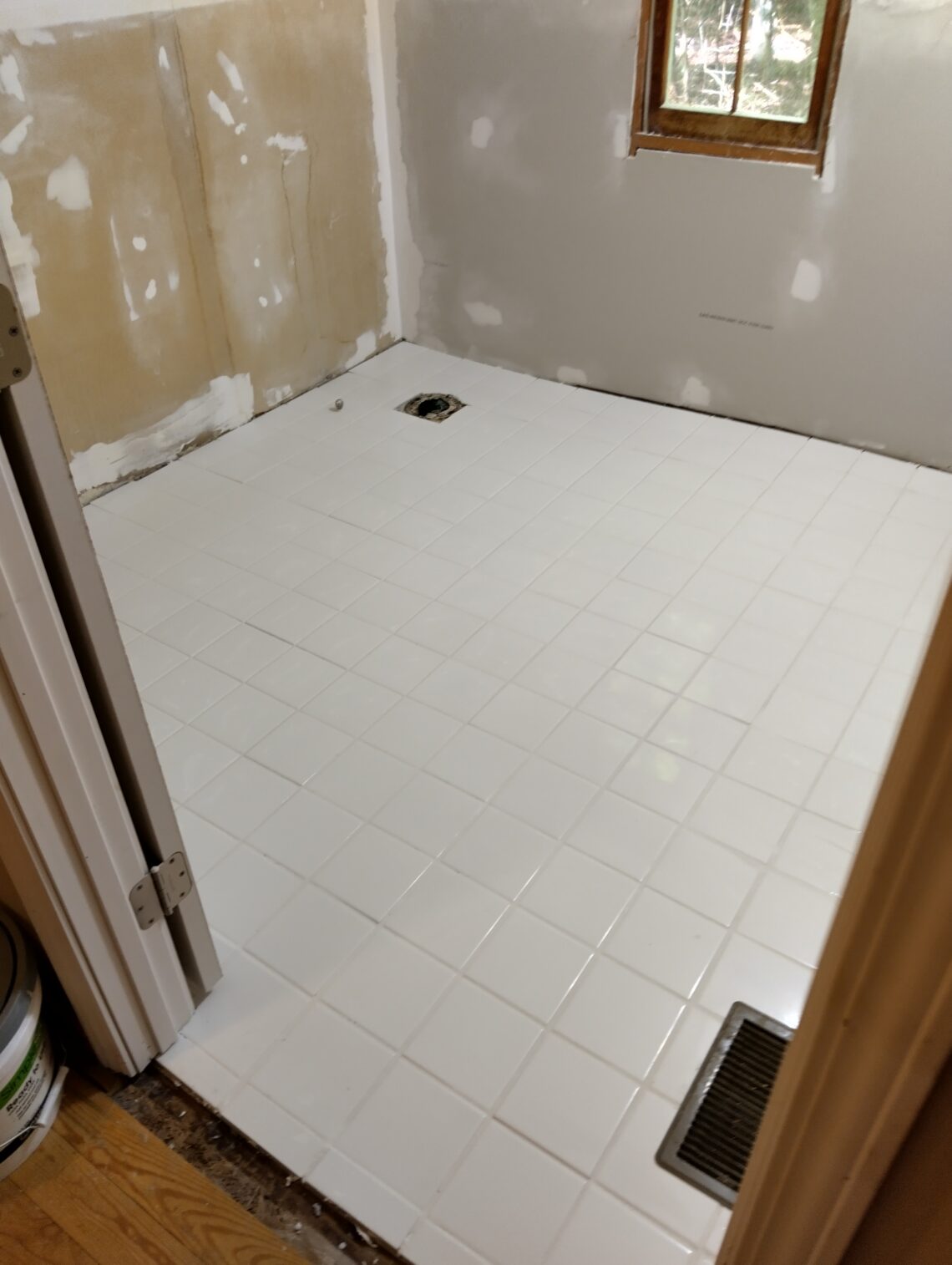 New white tiled bathroom floor